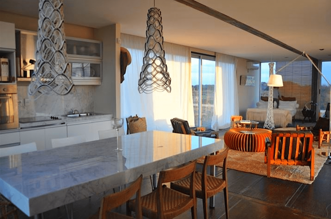 25-Container Houses in Canada! 1 The interiors of capsule container houses often feature a minimalist design, maximizing space and functionality. Open-concept layouts, abundant natural light, and smart storage solutions create a sense of spaciousness. Modern amenities, such as sleek kitchens and contemporary bathrooms, enhance the living experience, while sustainable materials and energy-efficient systems contribute to eco-friendly living. The unique architectural character of container living is celebrated through thoughtful design choices, resulting in inviting and comfortable spaces.