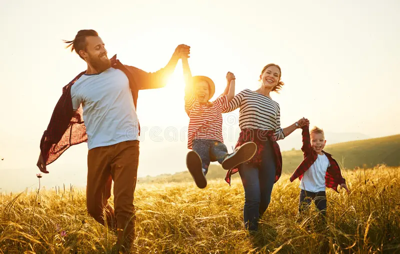 Joyful family enjoying outdoor time together in the garden.